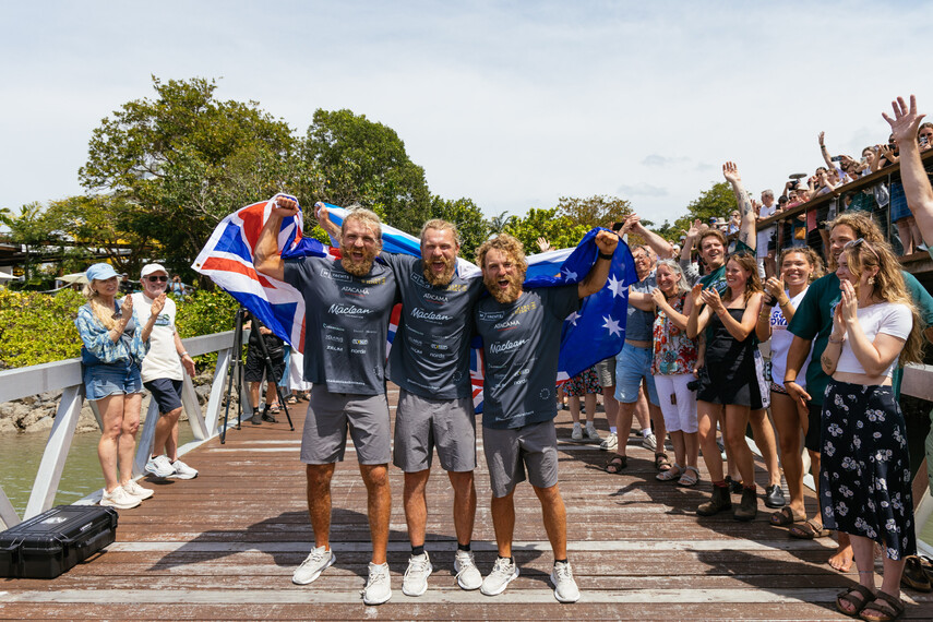 The Maclean brothers celebrate their arrival after crossing the ocean with spectators